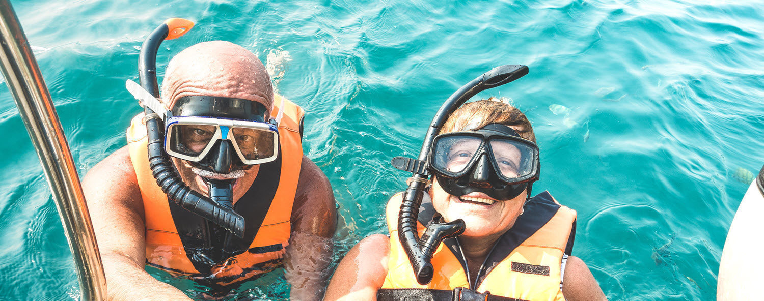 A couple goes snorkeling.
