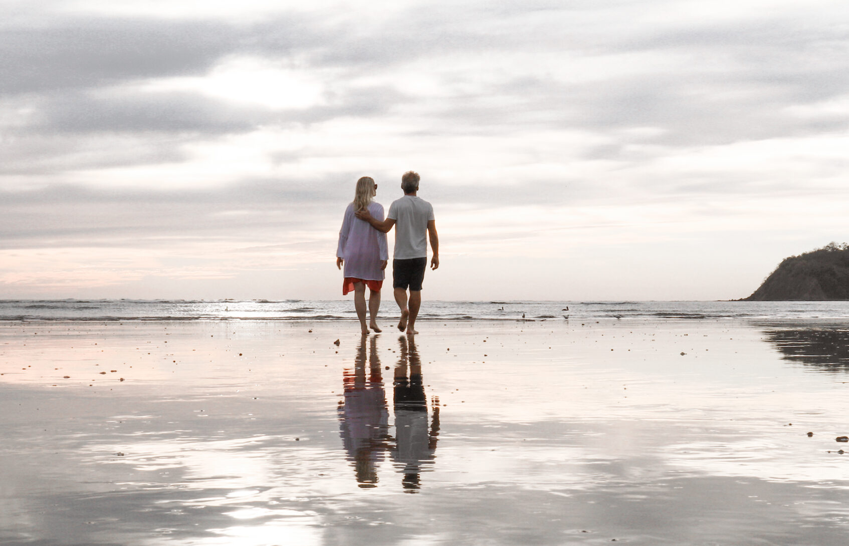 A couple walking on the beach