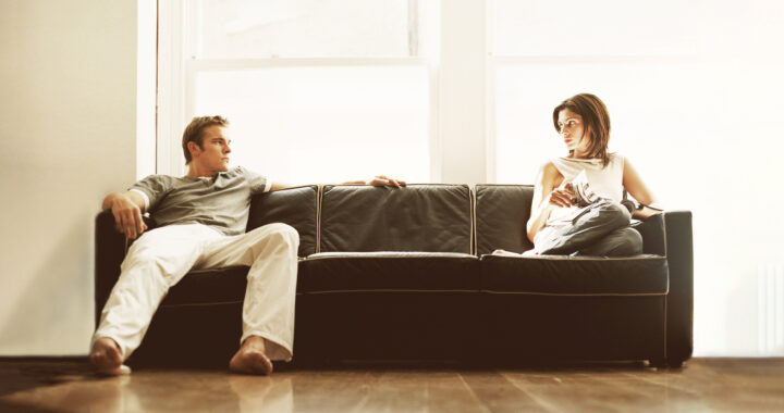 Man and woman sitting on a sofa