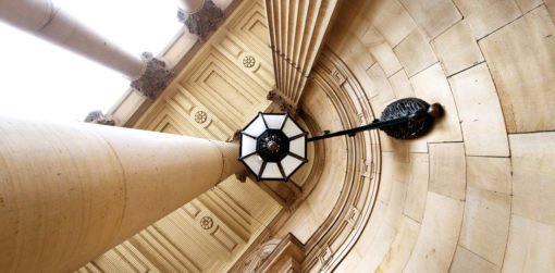 Image of the entrance to the Capitol Building looking up at architectural detail