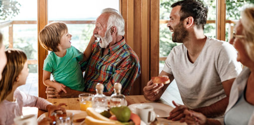 A family talks around the kitchen table.