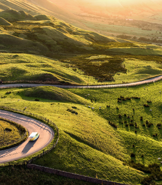 A curvy road passes over hills