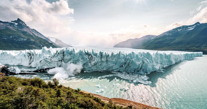 Ice falls into the water from the Perito Moreno Glacier in Patagonia Argentina