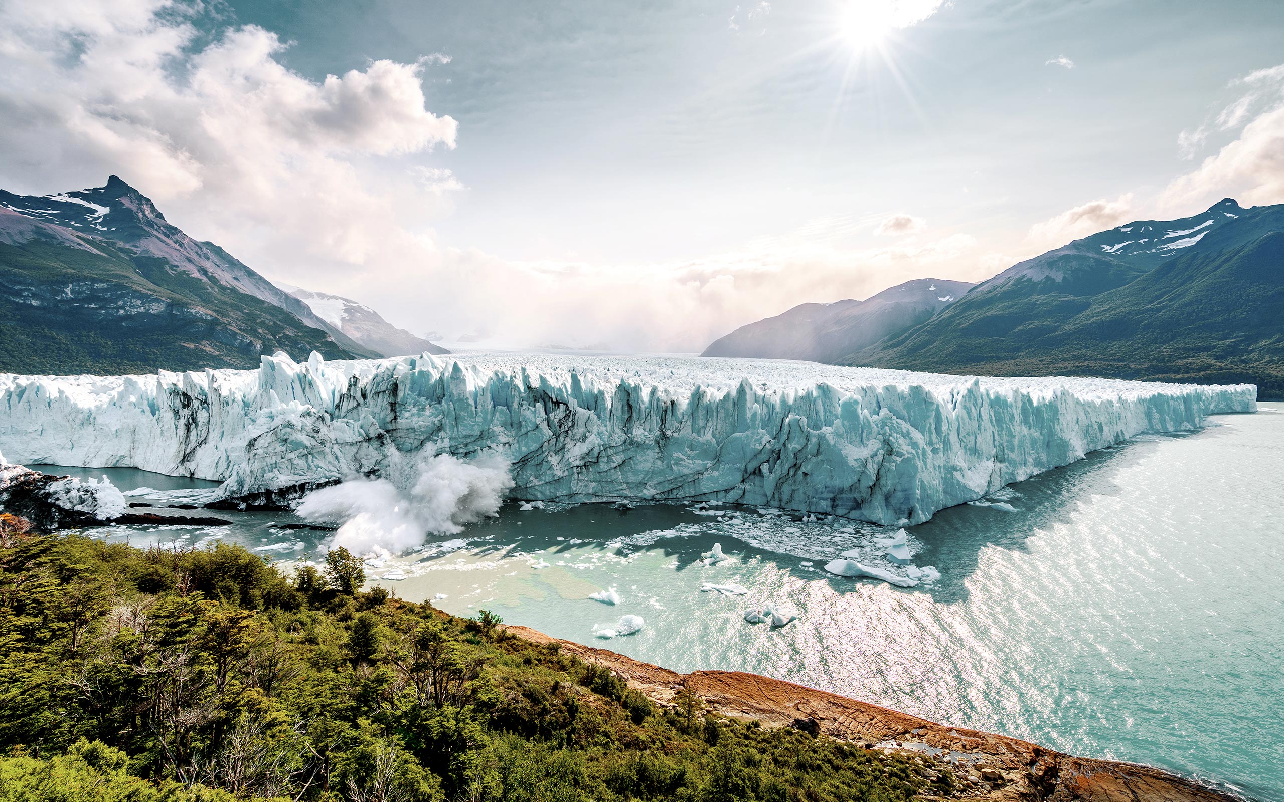 Ice falls into the water from the Perito Moreno Glacier in Patagonia Argentina