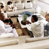 Multigenerational family seated in the living room