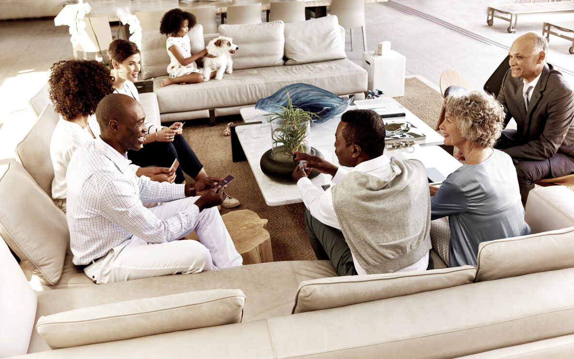 Multigenerational family seated in the living room