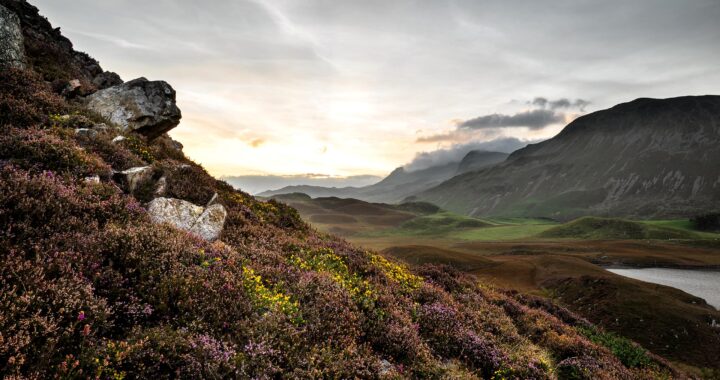 Stunning Summer dawn over mountain range in the Scottish Highlands