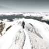 Mountaineer trekking to the top of Mont Blanc mountain in French Alps.