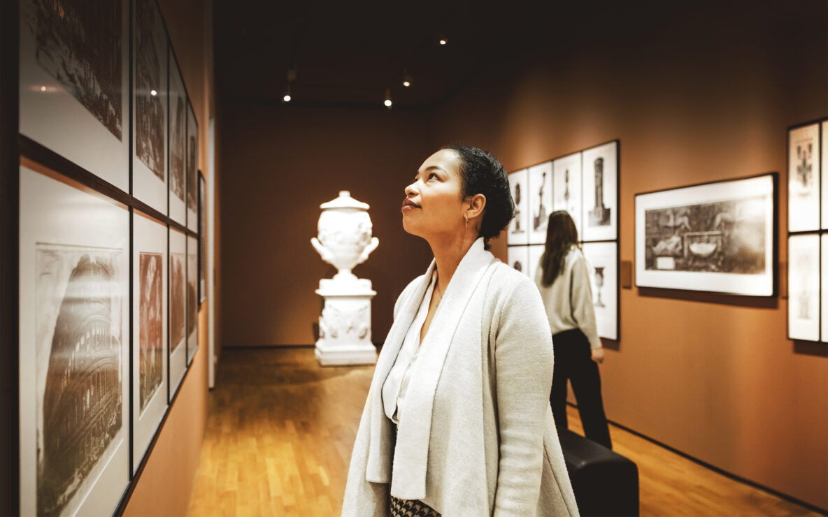 Woman looking at art in a gallery.