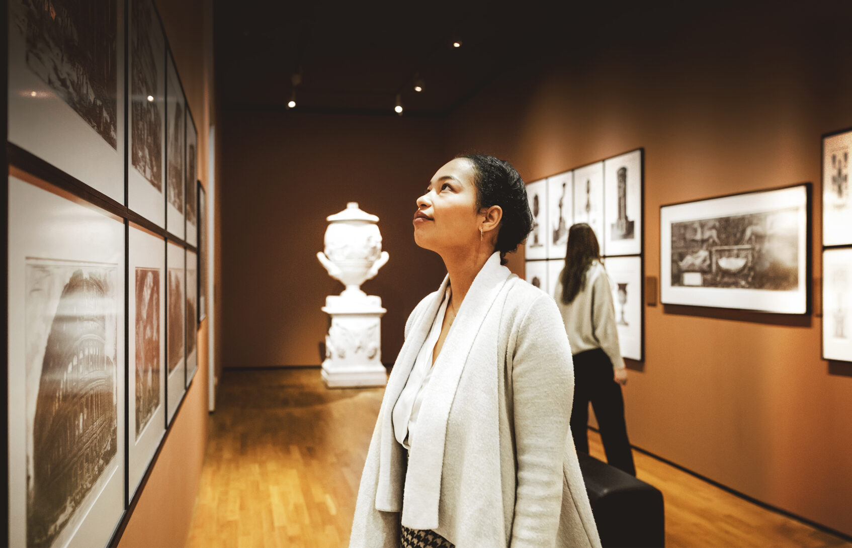 Woman looking at art in a gallery.