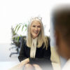 Businesswoman seated across from client