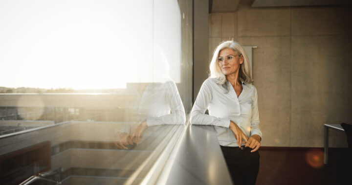 A businesswoman looking out the window.