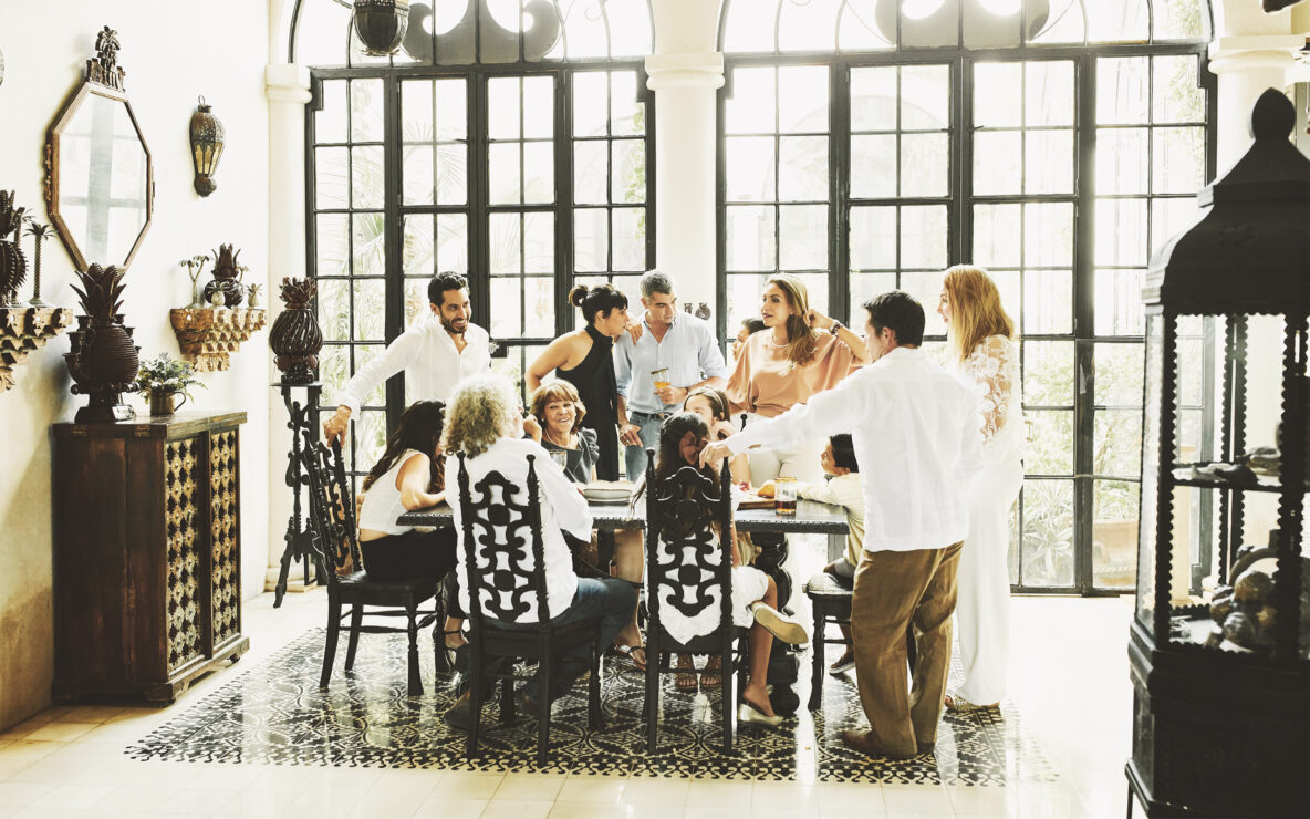 Multigenerational family gathered around dining table.
