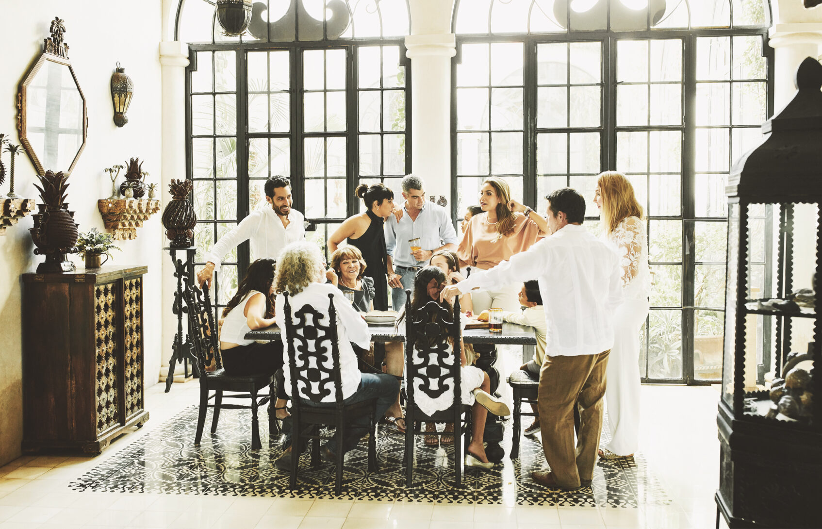 Multigenerational family gathered around dining table.