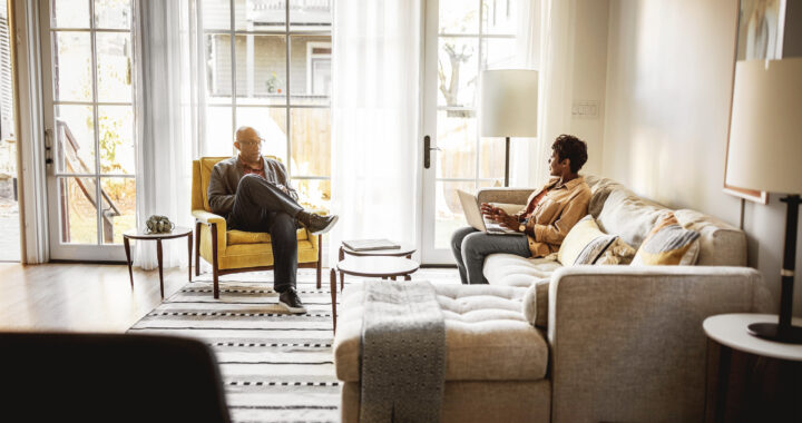 Couple seated in the living room